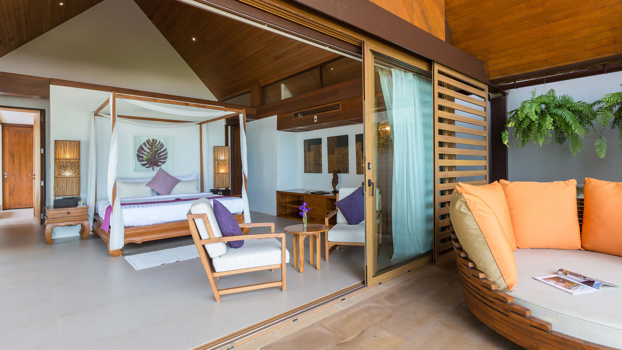 Baan Puri suite with a four-poster bed